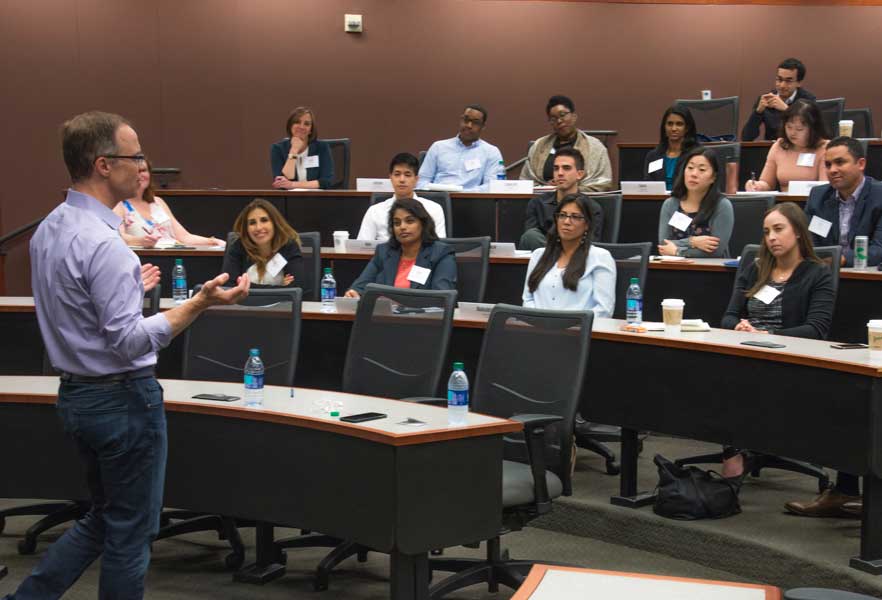 Speaker and audience in a lecture hall.